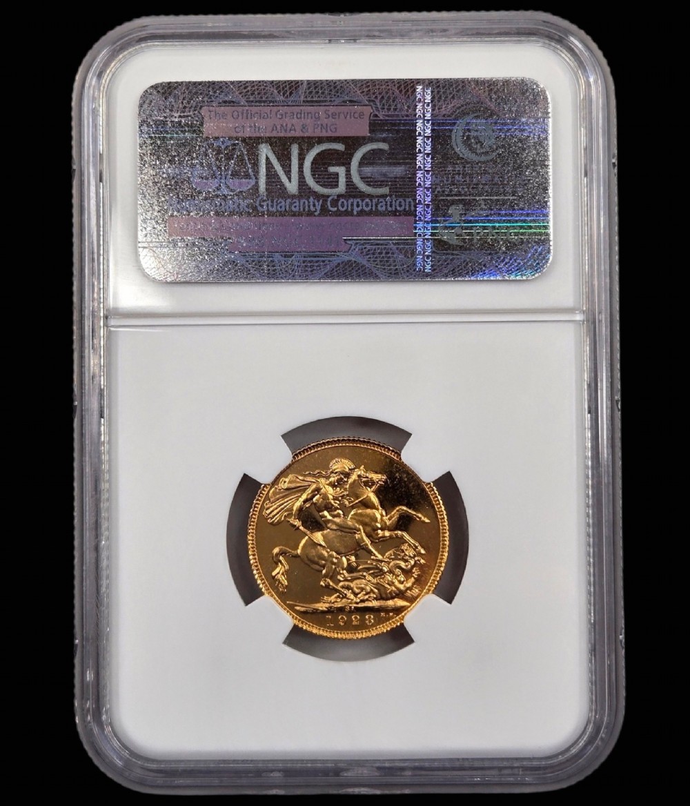 A 1923 South Africa gold sovereign coin featuring the bare head profile portrait of King George V, encapsulated in a white plastic NGC PF 65 grading slab. View II