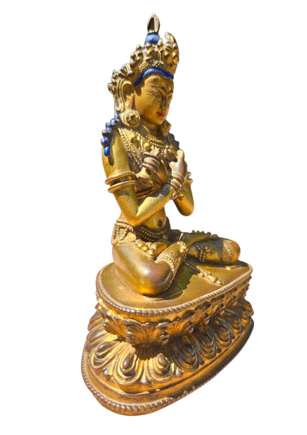 An 18th-century Sino-Tibetan gilt-bronze figure depicting the deity Vajradhara seated in meditation upon a double lotus pedestal. View VI