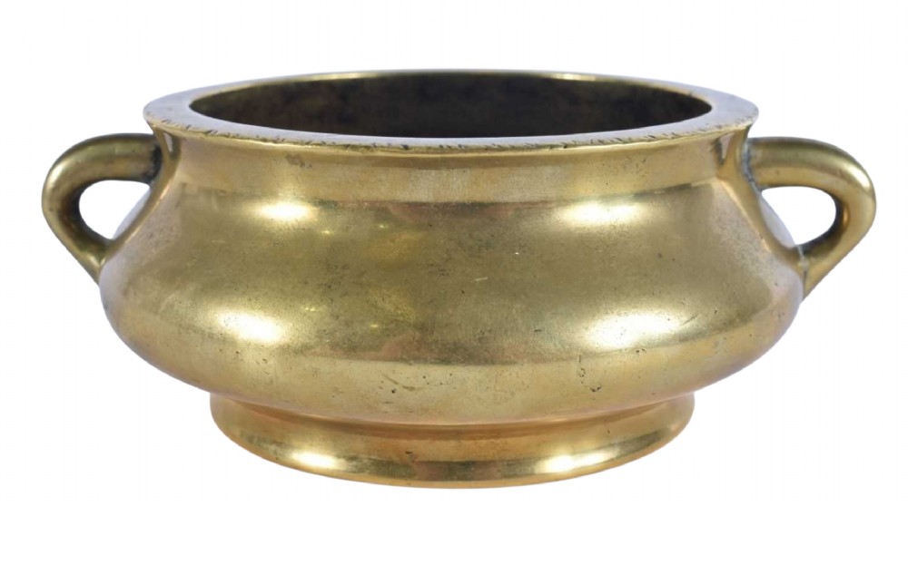 An 18th-century cast bronze incense burner featuring a compressed rounded body, flared rim, two loop handles, and a burnished golden patinated finish. View II