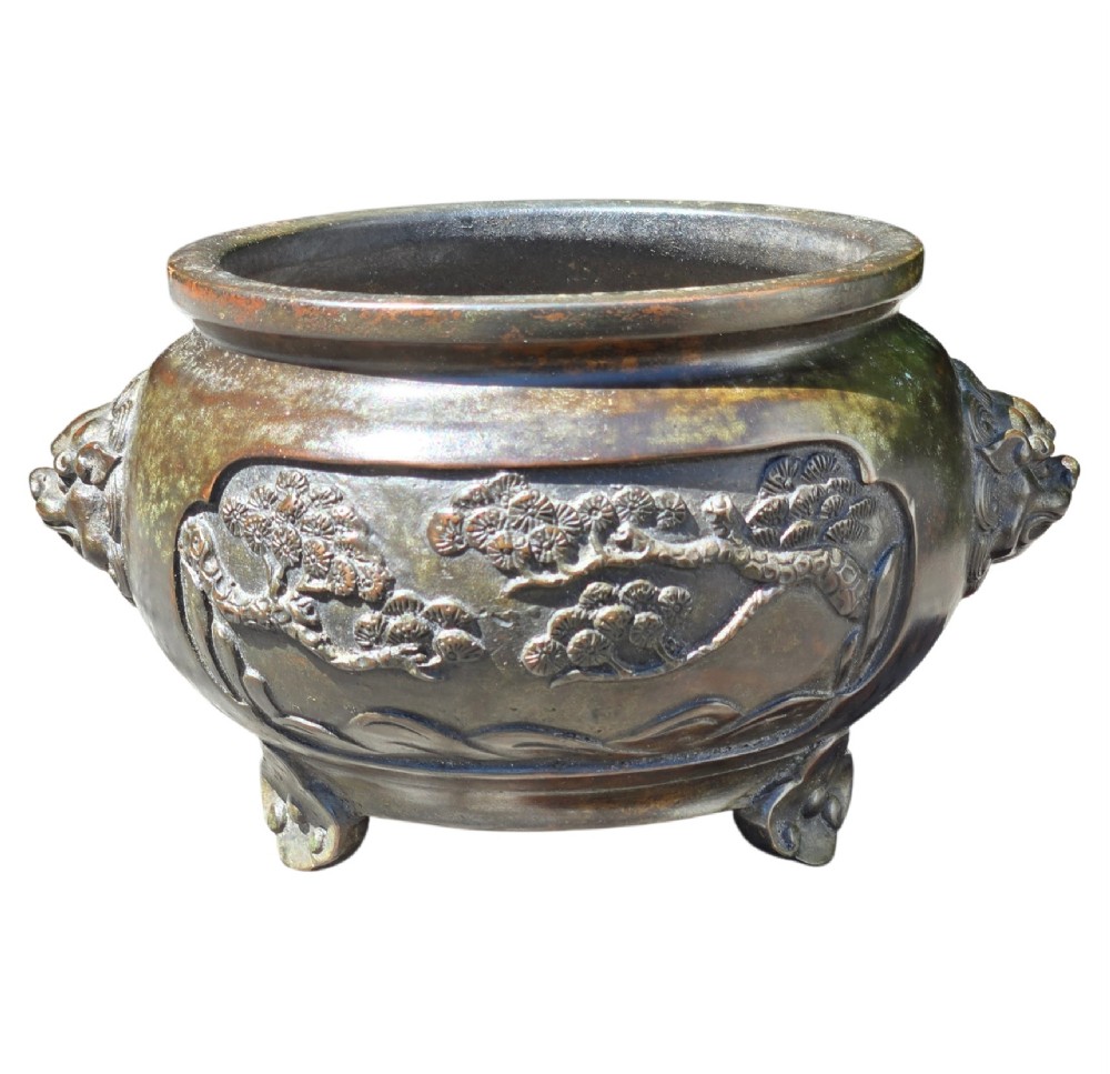 A dark patinated cast bronze incense burner featuring raised relief panels of bamboo and beast mask side handles. View XIV