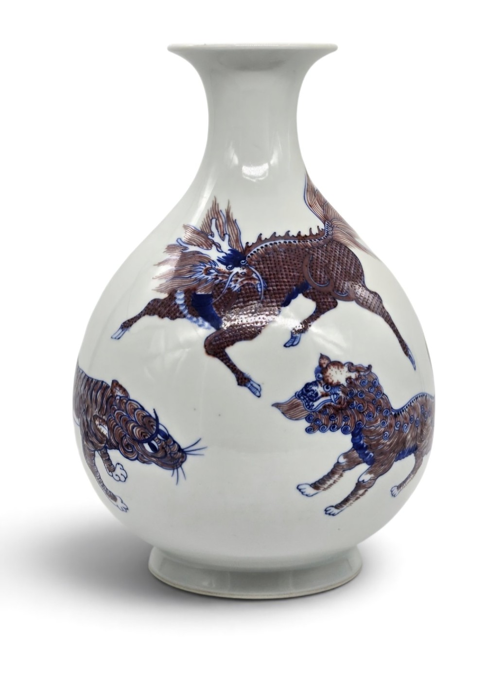 A white porcelain garlic-mouth vase featuring underglaze blue and copper-red painted depictions of mythical beasts.