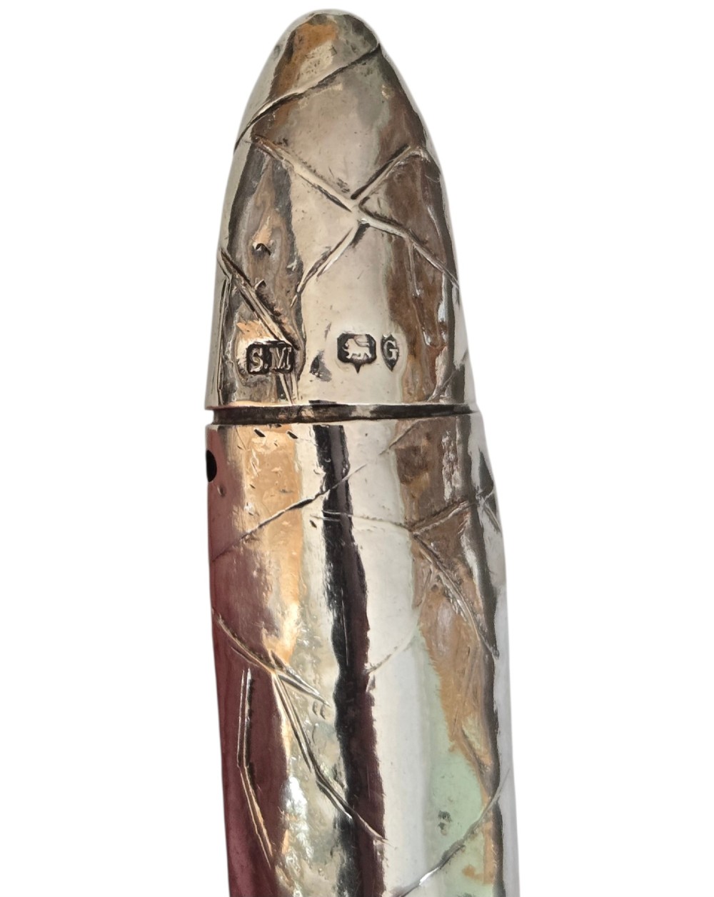 A Victorian sterling silver vesta case crafted in the shape of a double-ended cigar with engraved leaf textures. View VIII