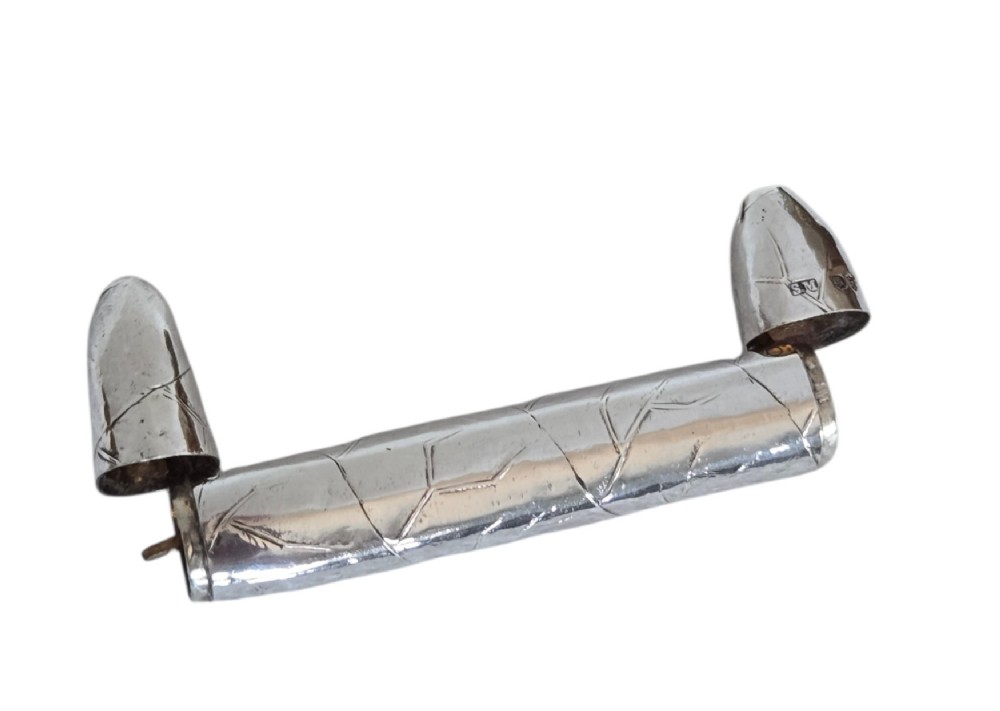 A Victorian sterling silver vesta case crafted in the shape of a double-ended cigar with engraved leaf textures. View XIII