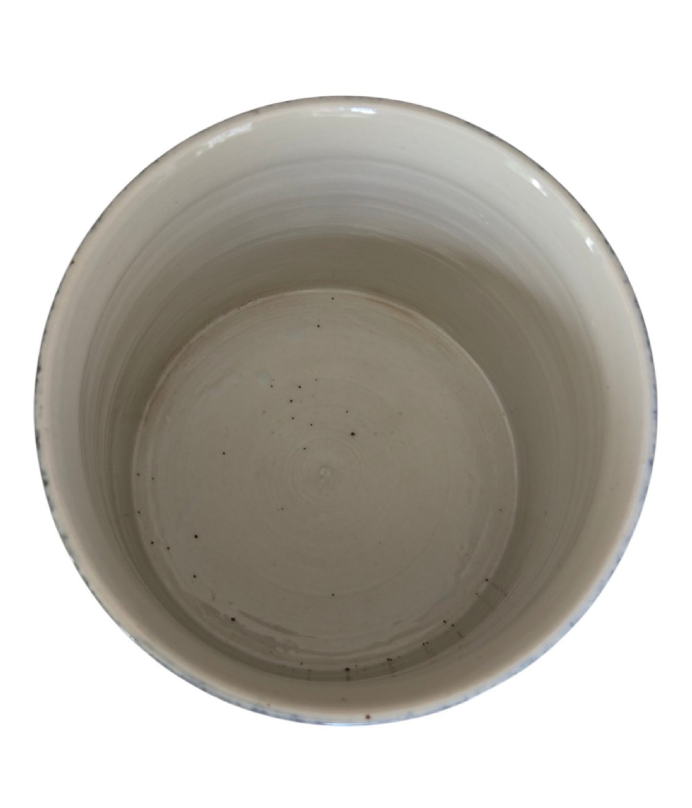 A cylindrical Chinese porcelain brush pot featuring a mottled powder-blue glaze with a pale rim. View V