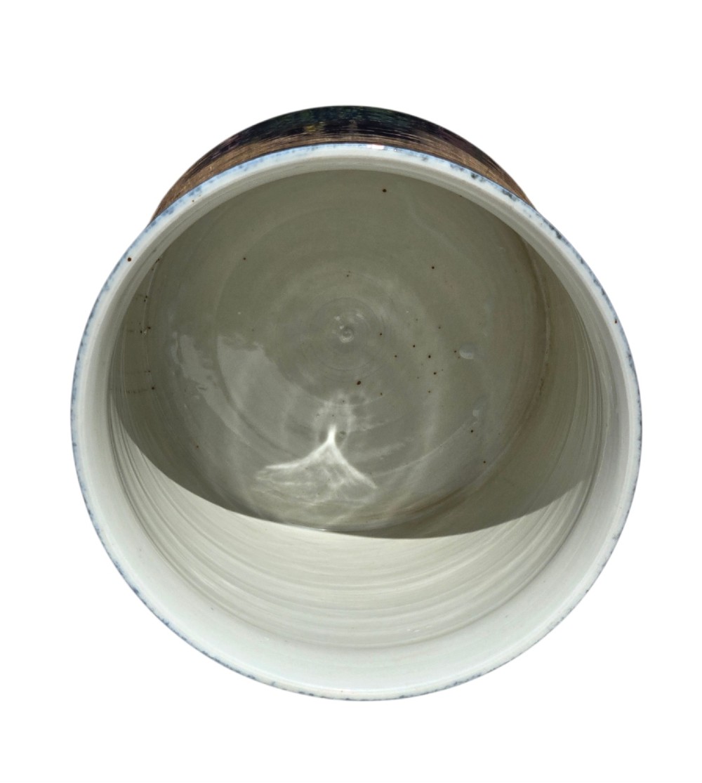 A cylindrical Chinese porcelain brush pot featuring a mottled powder-blue glaze with a pale rim. View XII