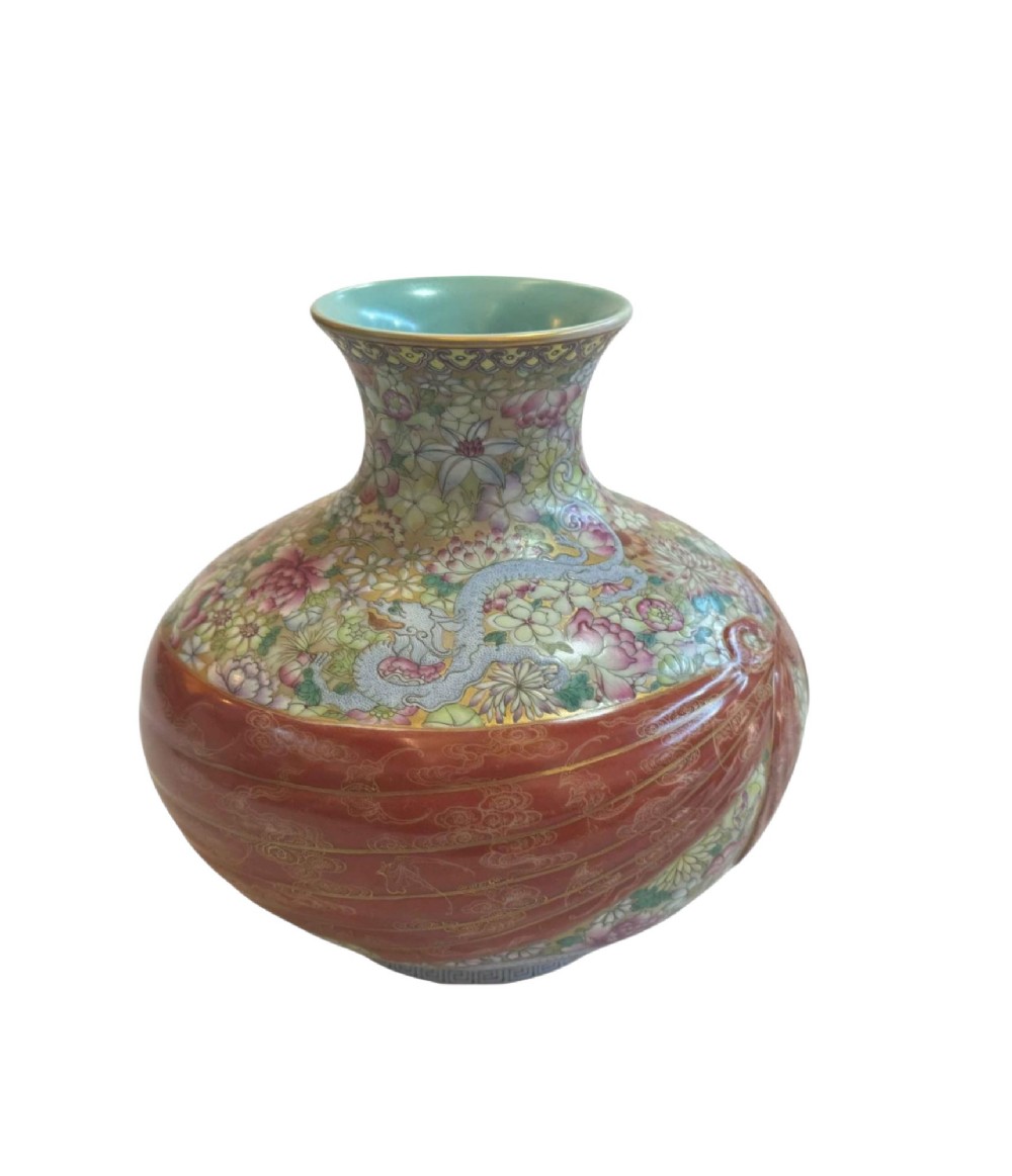 A spherical porcelain vase decorated with a dense millefleurs floral pattern, dual dragon motifs, a tied iron-red ribbon motif, and a turquoise interior rim. View VI