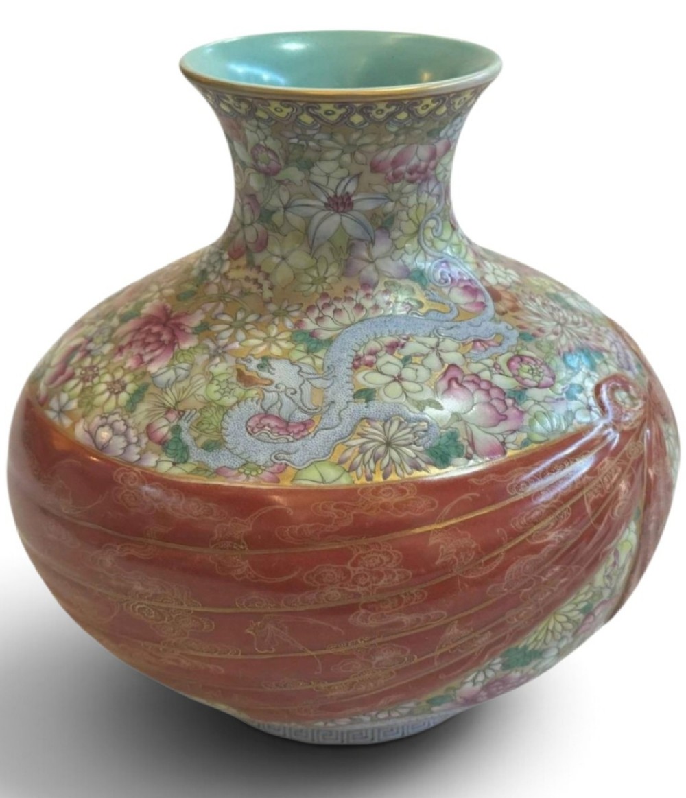 A spherical porcelain vase decorated with a dense millefleurs floral pattern, dual dragon motifs, a tied iron-red ribbon motif, and a turquoise interior rim. View XI