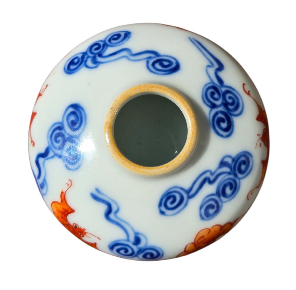 A squatted Chinese porcelain brush washer decorated with underglaze cobalt blue clouds and copper red bats on a white glazed ground. View X