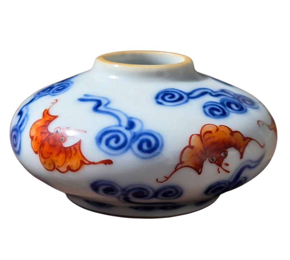 A squatted Chinese porcelain brush washer decorated with underglaze cobalt blue clouds and copper red bats on a white glazed ground. View XI