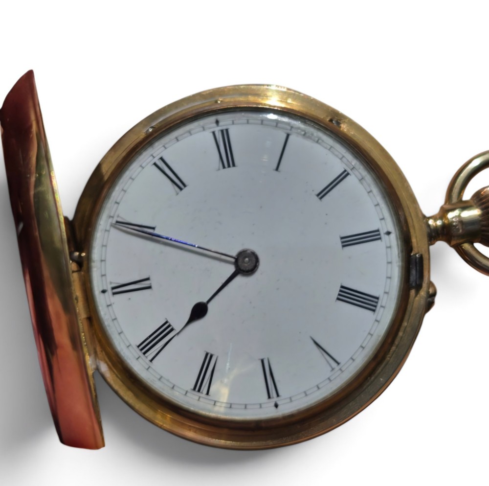 An 18-karat gold Victorian pocket watch casing displaying a polychrome enamelled coat of arms flanked by griffin supporters and a heraldic motto banner. View XV