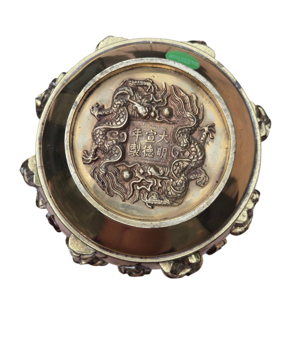 A late 19th-century Chinese brass baluster vase featuring raised high-relief carvings of Daoist figures, clouds, and floral handles. View II