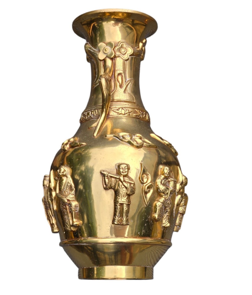 A late 19th-century Chinese brass baluster vase featuring raised high-relief carvings of Daoist figures, clouds, and floral handles. View V