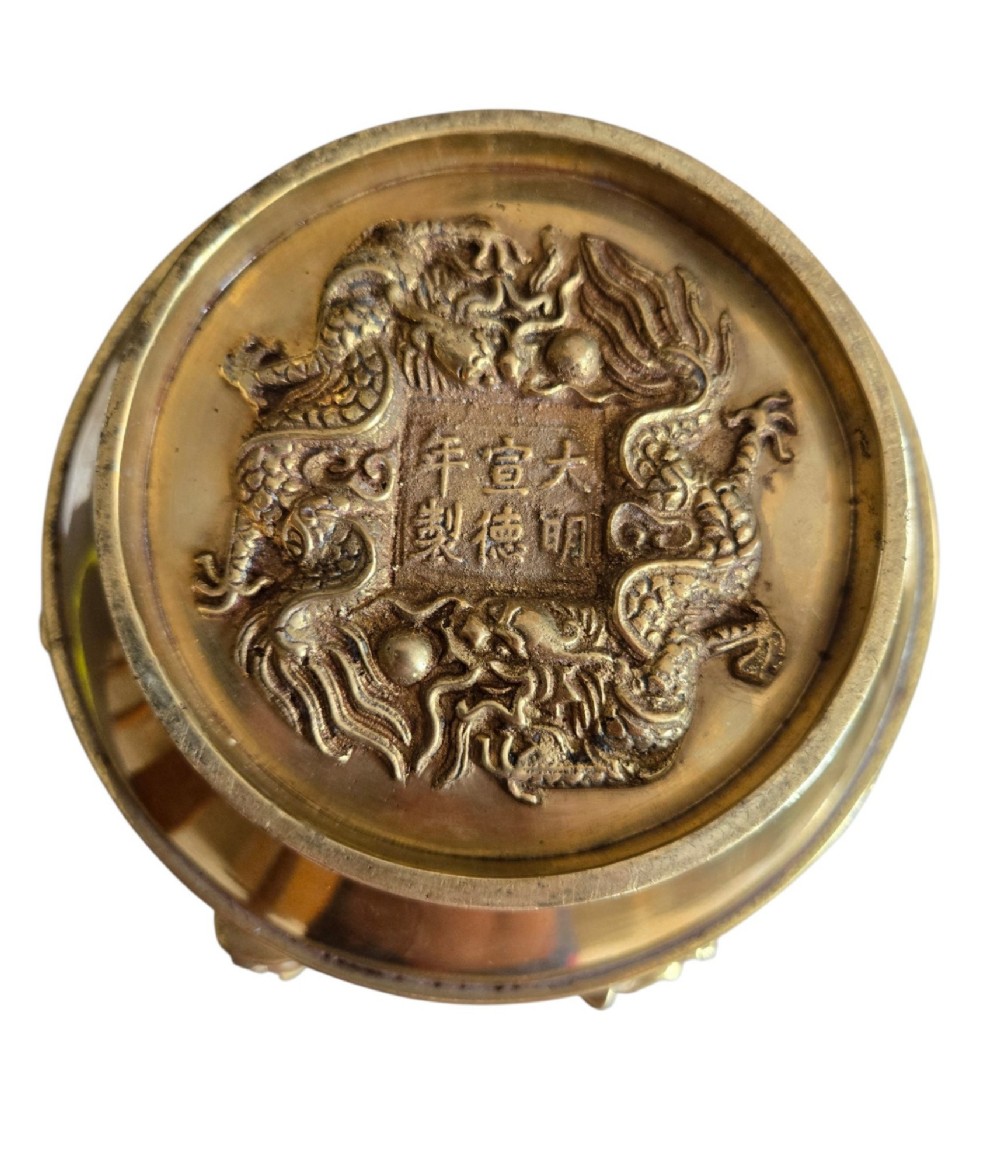 A late 19th-century Chinese brass baluster vase featuring raised high-relief carvings of Daoist figures, clouds, and floral handles. View VIII
