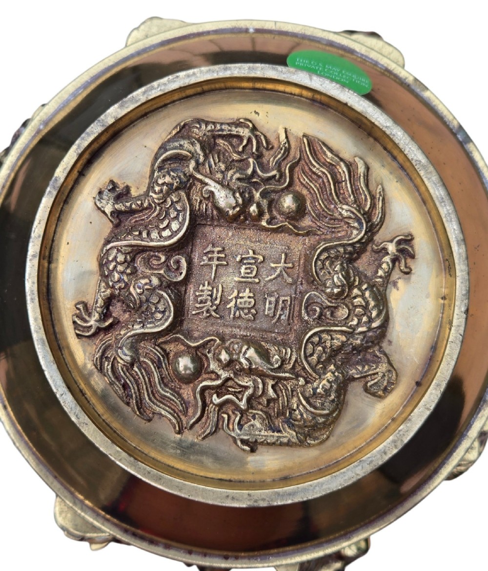 A late 19th-century Chinese brass baluster vase featuring raised high-relief carvings of Daoist figures, clouds, and floral handles. View XII