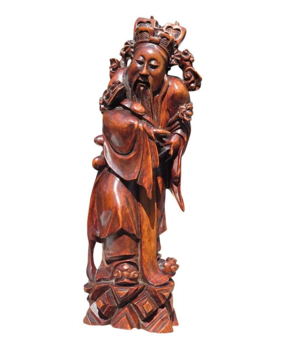 A pair of Chinese hardwood sculptures depicting Daoist immortals in flowing robes with carved geometric bases. View XIII