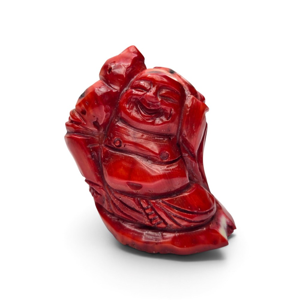 A Chinese Carved Precious Red Coral Figural Group of Budai ​Late Qing to Republic Period (circa 19th/early 20th century)