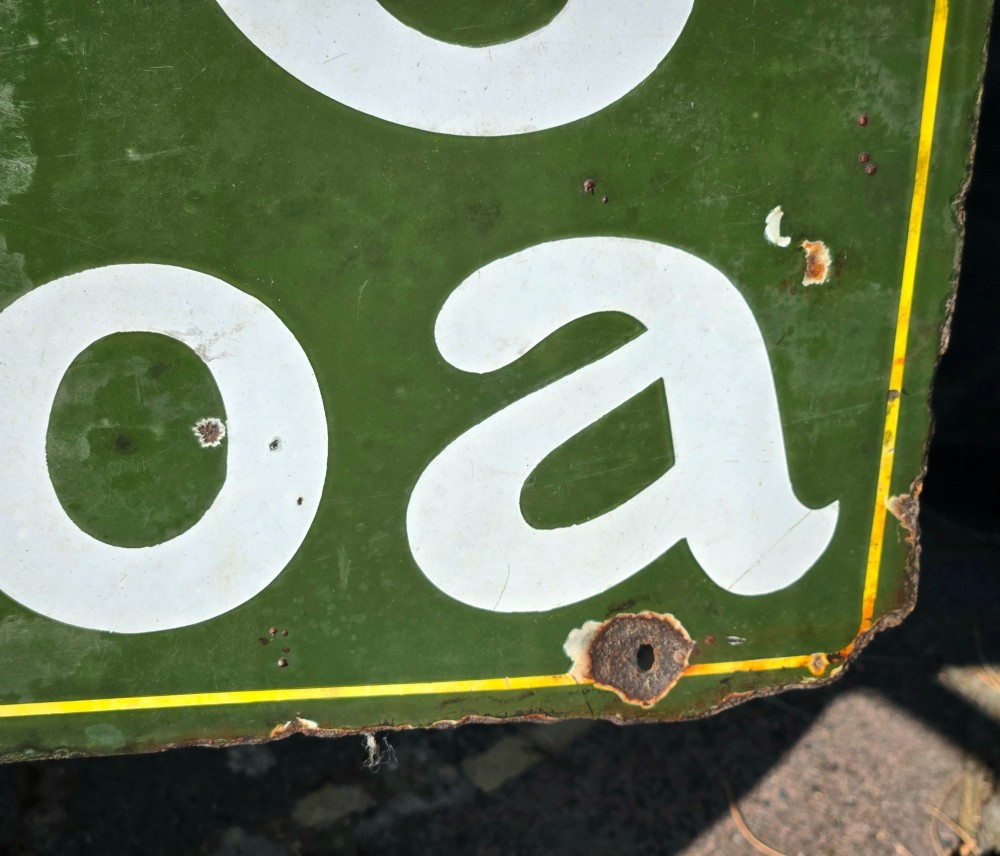A large rectangular bottle green enamel sign featuring white and yellow typography for Rowntrees Elect Cocoa with a royal crest. View IV