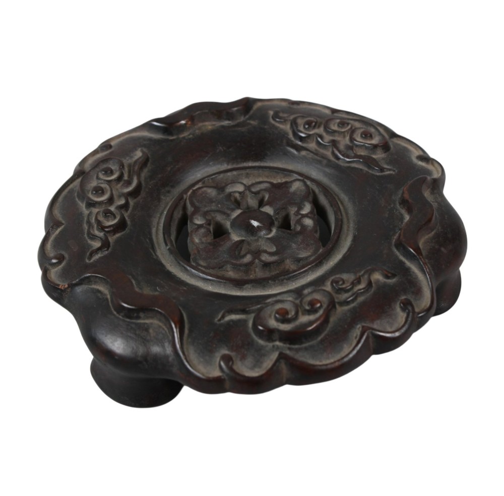A rounded dark bronze Chinese censer with elephant head handles, topped with a polished wood lid featuring a green jade finial, resting on a carved hardwood stand. View VIII