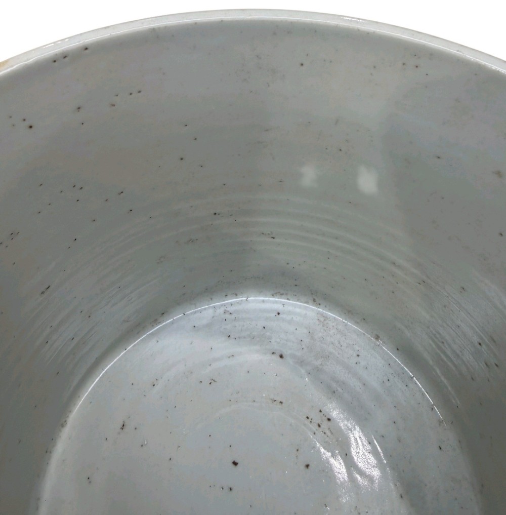 A cylindrical Chinese blue and white porcelain brush pot decorated with a painted mountain landscape and calligraphic text. View XIII