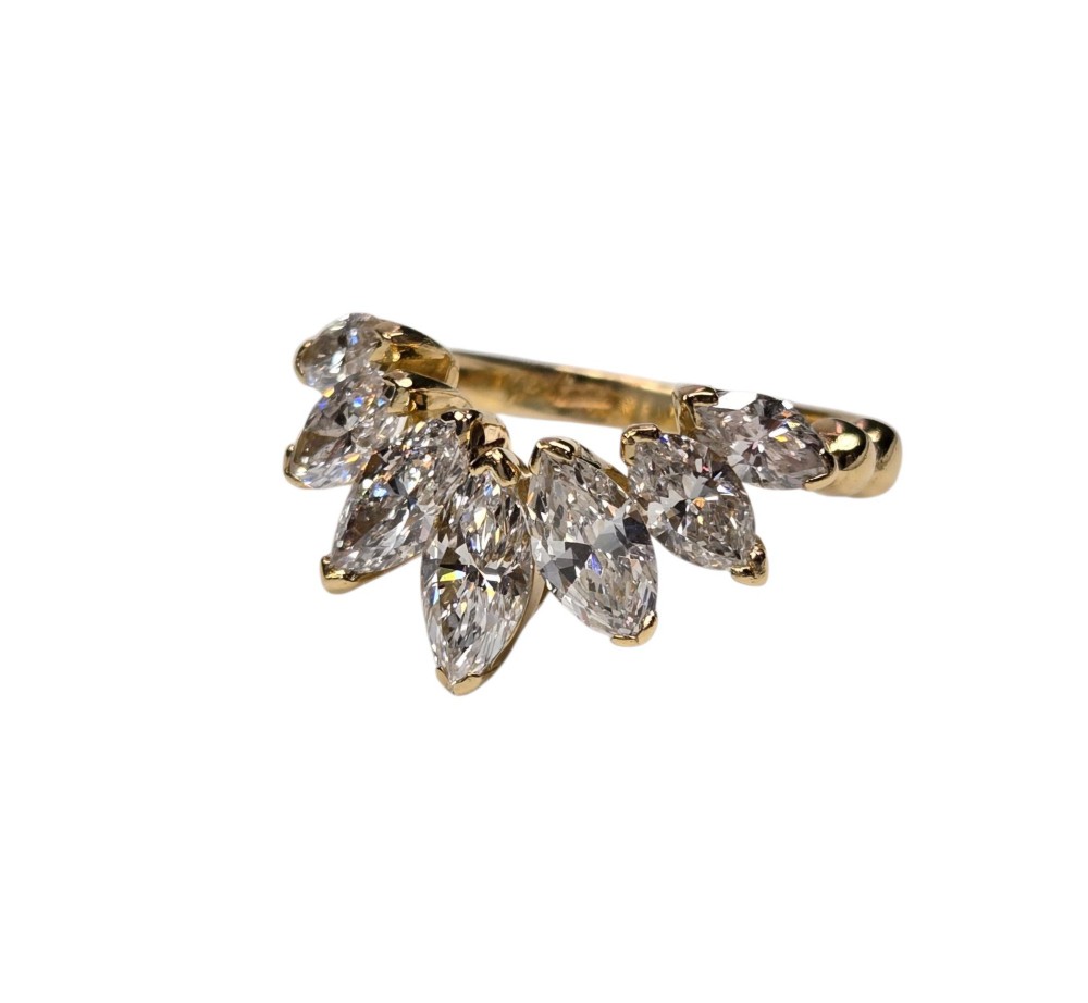An 18ct yellow gold dress ring by Kutchinsky featuring a graduated row of marquise-cut diamonds mounted on a textured beaded shank. View XIII