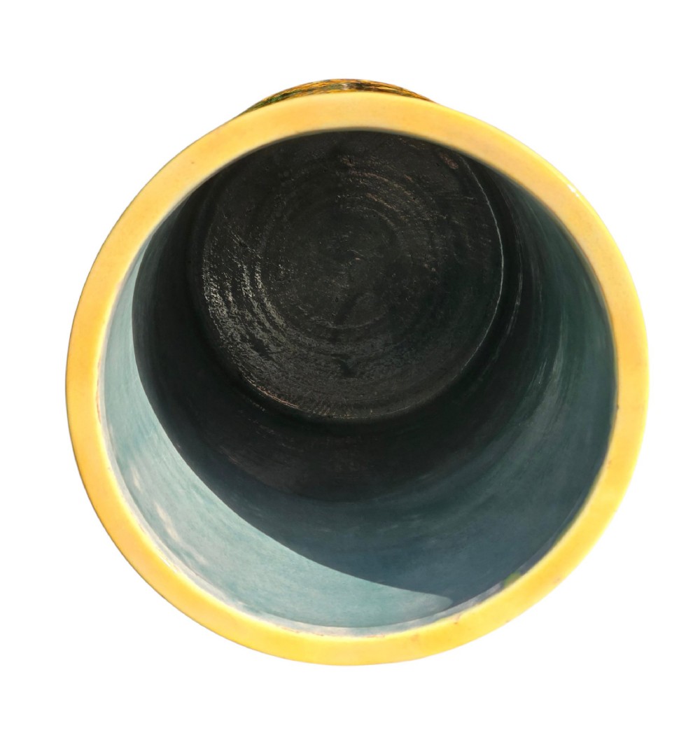 A tall cylindrical ceramic umbrella stand decorated with colourful Iznik-style floral medallions, turquoise scrolling foliage, and a deep purple glazed background. View VIII