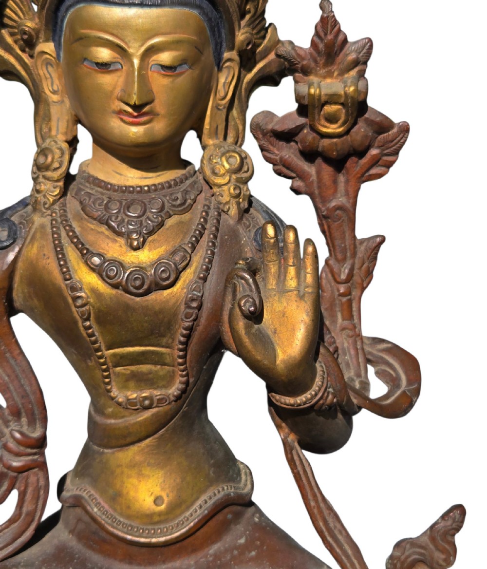An antique Sino-Tibetan gilt-bronze figure of Bodhisattva Manjushri seated cross-legged on a double-lotus base, brandishing a flaming sword in his right hand. View XI
