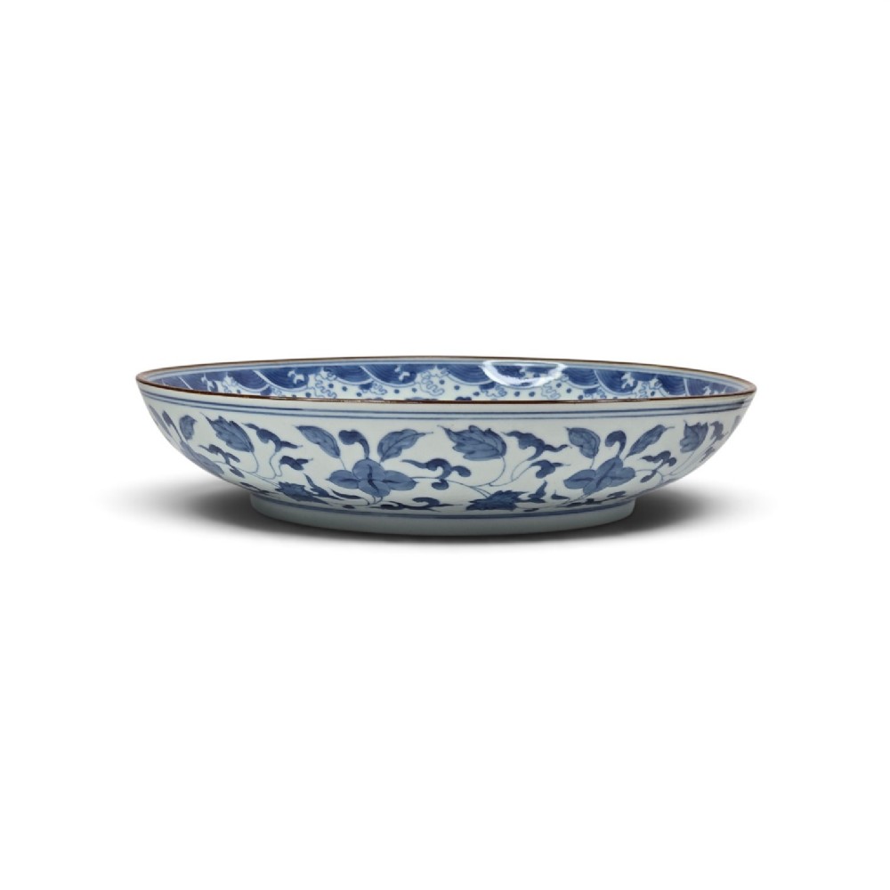 A circular Chinese blue and white porcelain charger featuring five-clawed dragons depicted among stylized clouds and flaming pearls. View XII