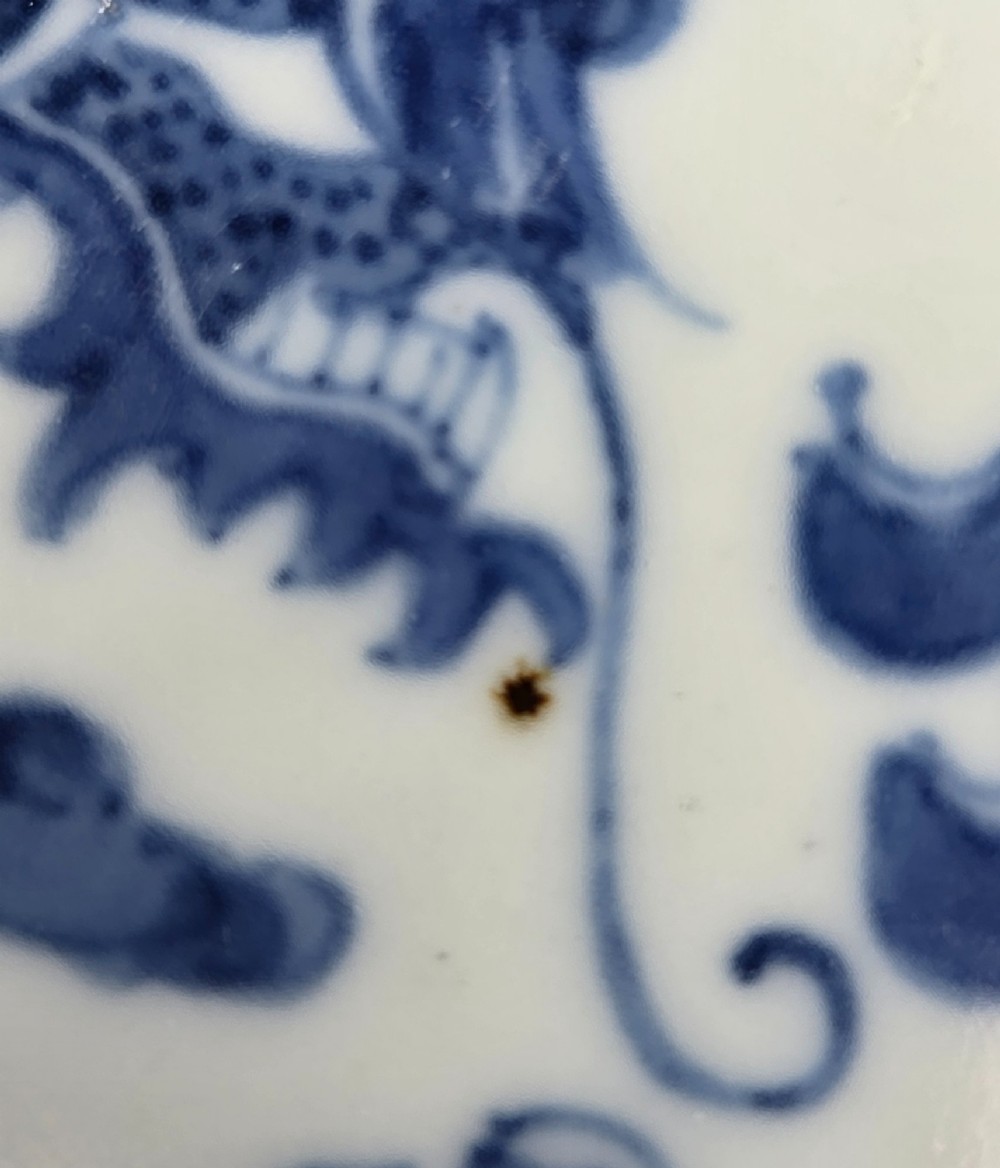 A circular Chinese blue and white porcelain charger featuring five-clawed dragons depicted among stylized clouds and flaming pearls. View XIII