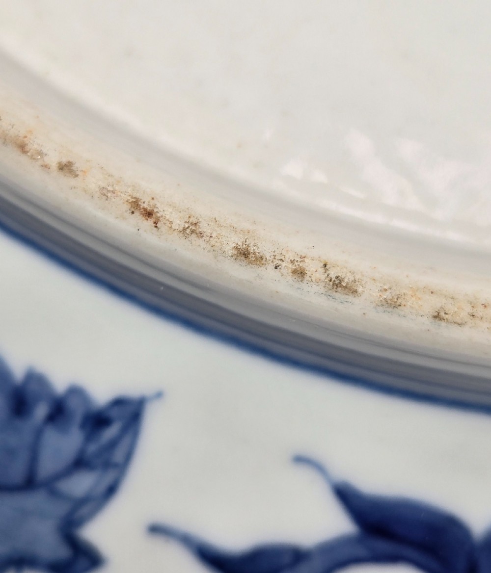 A circular Chinese blue and white porcelain charger featuring five-clawed dragons depicted among stylized clouds and flaming pearls. View XIV