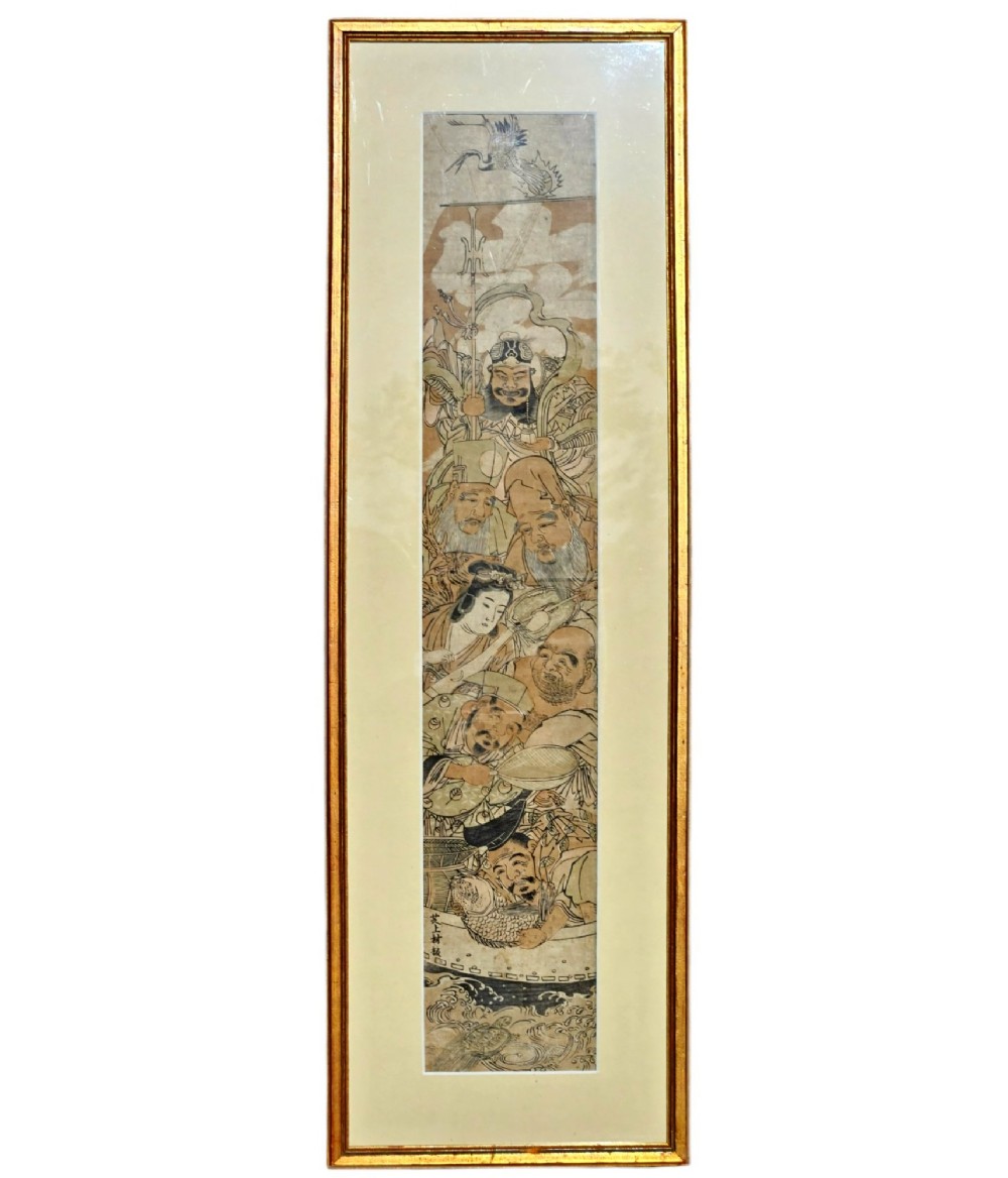 A tall framed Japanese ukiyo-e woodblock print depicting seven figures aboard a vessel beneath a flying crane, presented in a gold frame with a wide cream mount. View XI