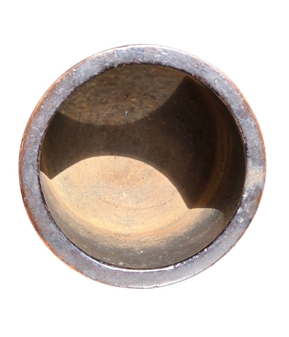 A cylindrical warm brown bronze tripod censer featuring a raised lobed cartouche with Arabic calligraphy set against a textured ground. View XII