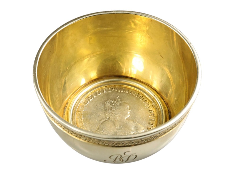 A circular gold silver-gilt presentation bowl featuring an engraved monogram and a carved leaf border near the upper rim. View XI
