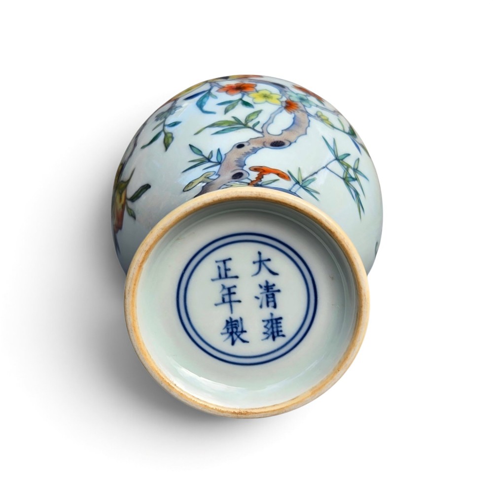A Chinese porcelain garlic-head vase decorated with hand-painted peaches, orange bats, green leaves, and blue rockwork on a white background. View VIII