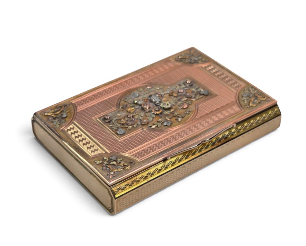 A rectangular nineteenth-century vari-colour 18ct gold snuff box featuring engine-turned guilloche patterns and a central raised floral relief panel. View II