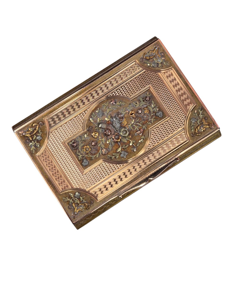 A rectangular nineteenth-century vari-colour 18ct gold snuff box featuring engine-turned guilloche patterns and a central raised floral relief panel. View X