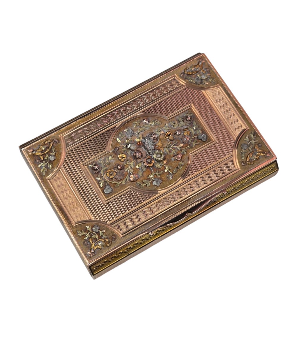 A rectangular nineteenth-century vari-colour 18ct gold snuff box featuring engine-turned guilloche patterns and a central raised floral relief panel. View XI