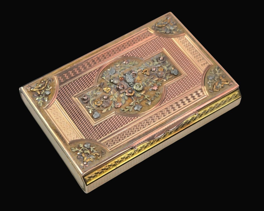 A rectangular nineteenth-century vari-colour 18ct gold snuff box featuring engine-turned guilloche patterns and a central raised floral relief panel. View XIV