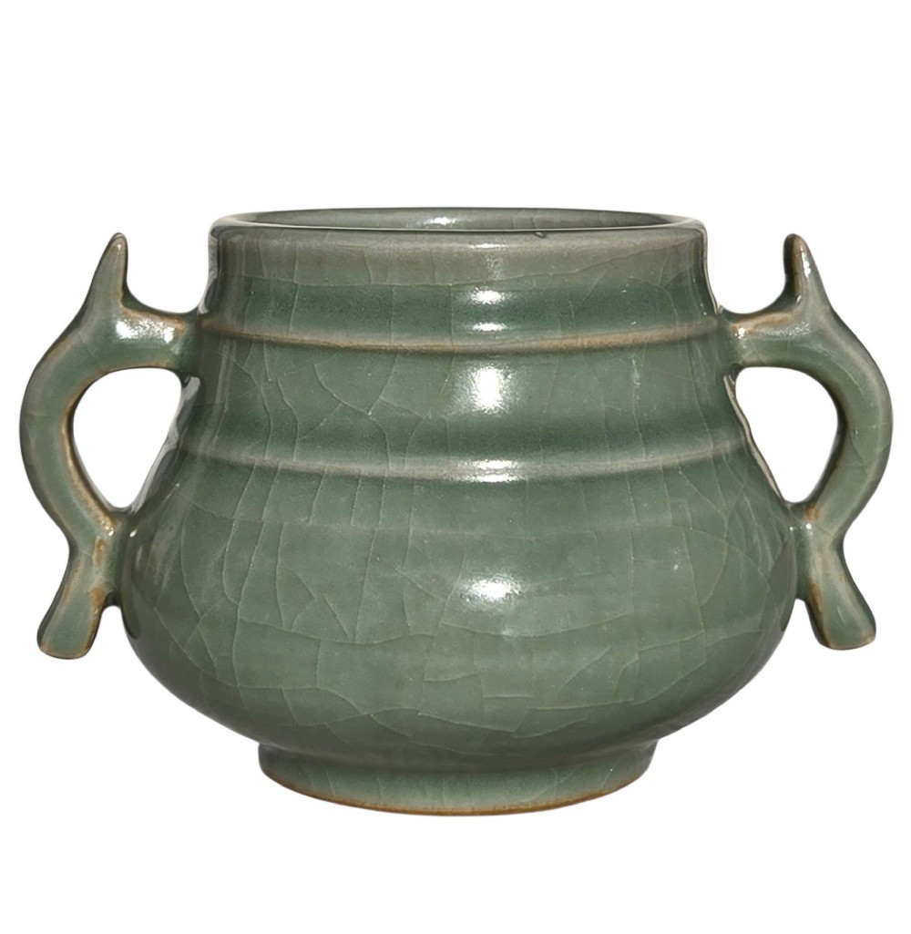 A celadon green crackle-glazed ceramic incense burner with two loop handles and raised horizontal bands.