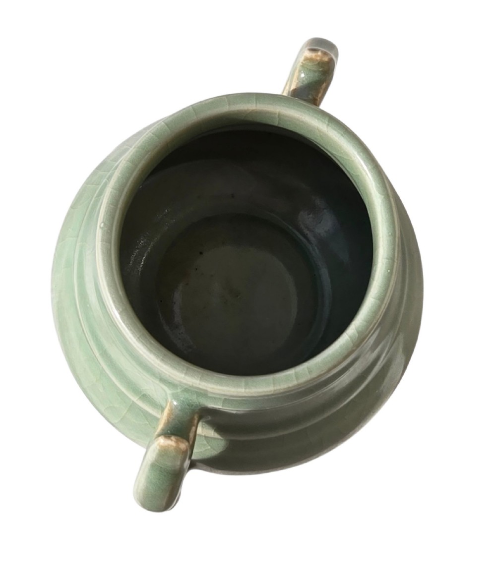 A celadon green crackle-glazed ceramic incense burner with two loop handles and raised horizontal bands. View II
