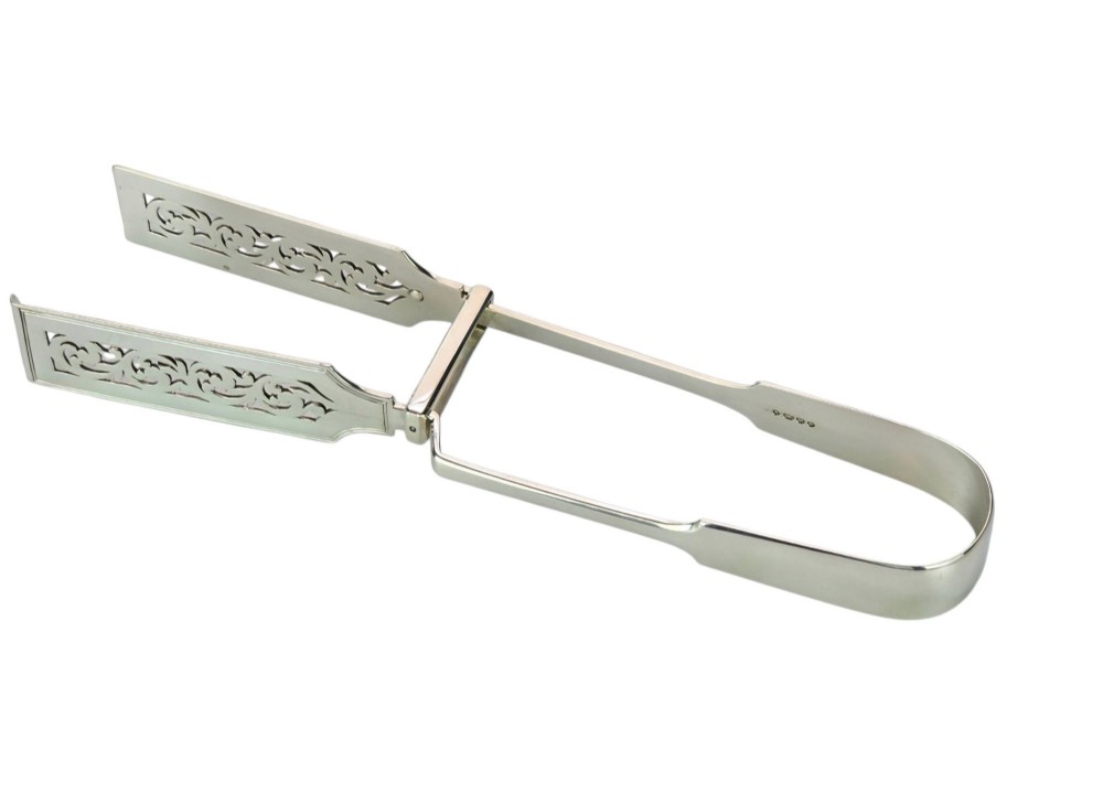Victorian sterling silver asparagus tongs featuring wide, pierced scrollwork blades and clear assay hallmarks along the upper arm. View XIV
