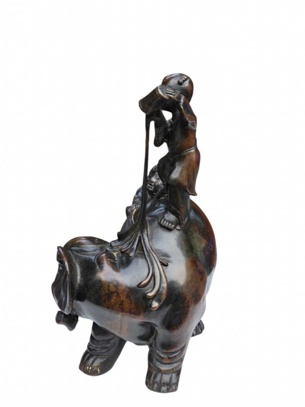 A dark patinated bronze Chinese sculpture depicting two young boys washing a caparisoned elephant. View VII