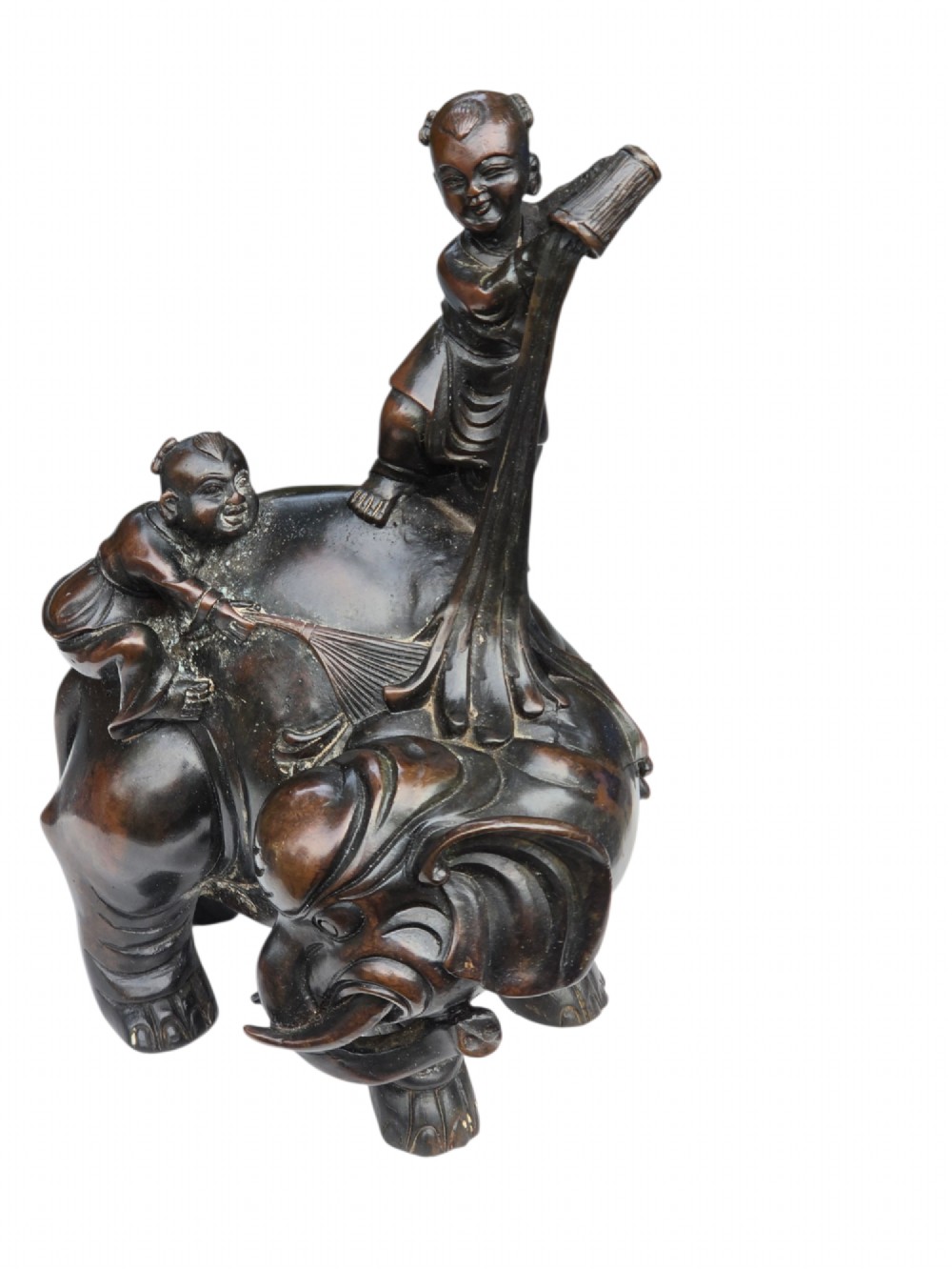 A dark patinated bronze Chinese sculpture depicting two young boys washing a caparisoned elephant. View IX