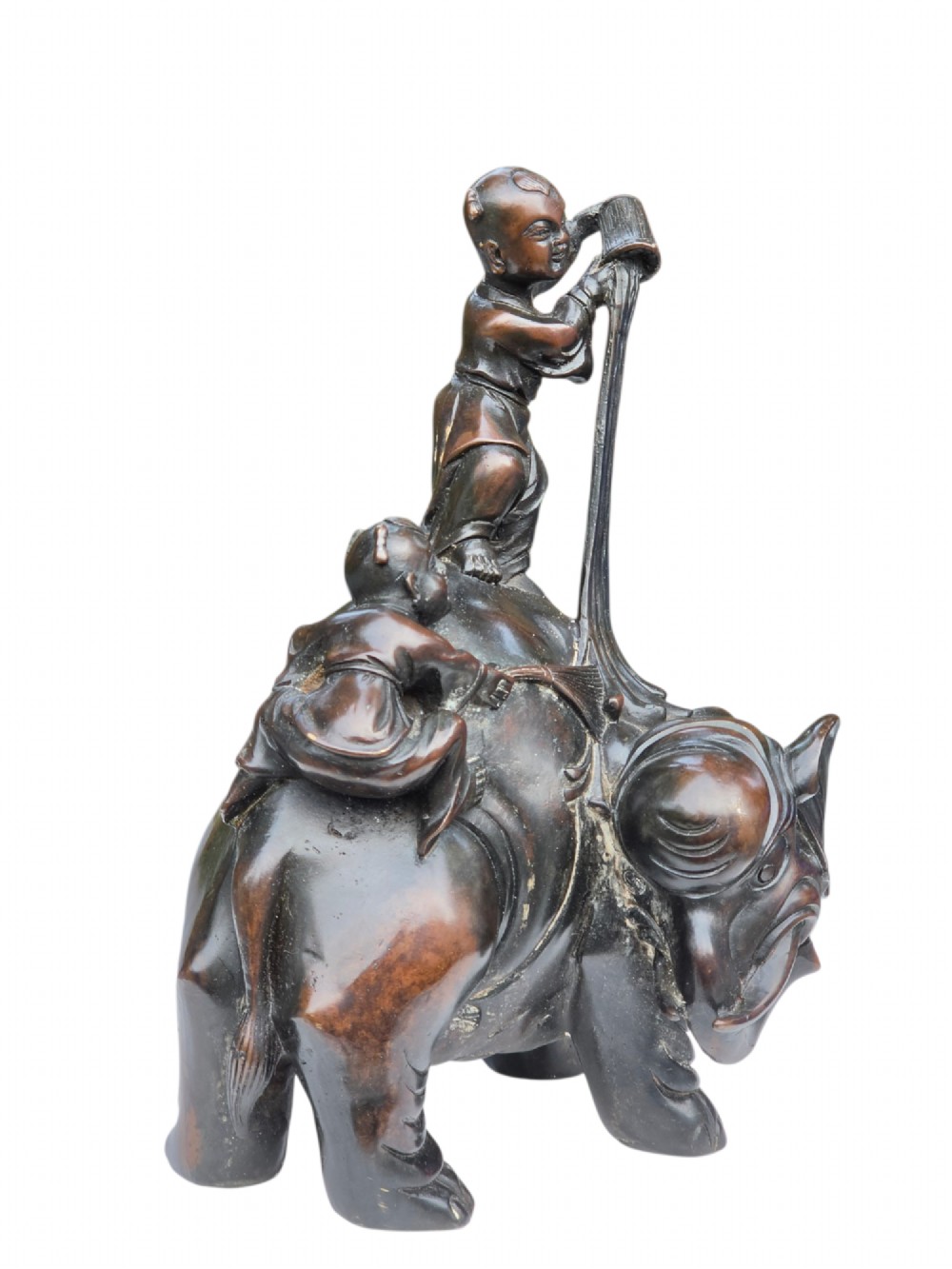 A dark patinated bronze Chinese sculpture depicting two young boys washing a caparisoned elephant. View XI