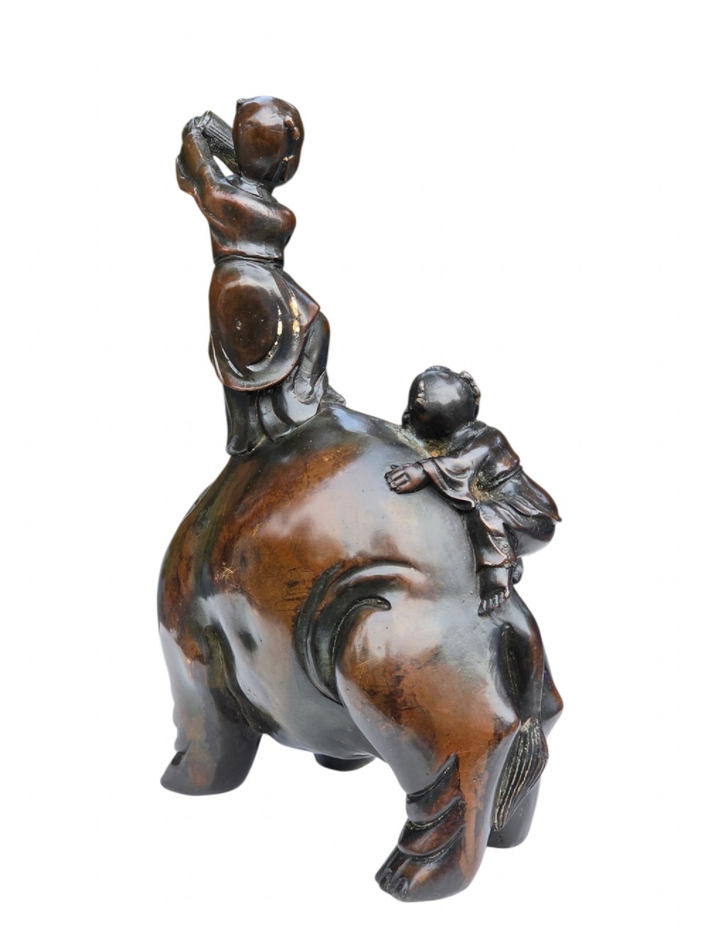 A dark patinated bronze Chinese sculpture depicting two young boys washing a caparisoned elephant. View XII