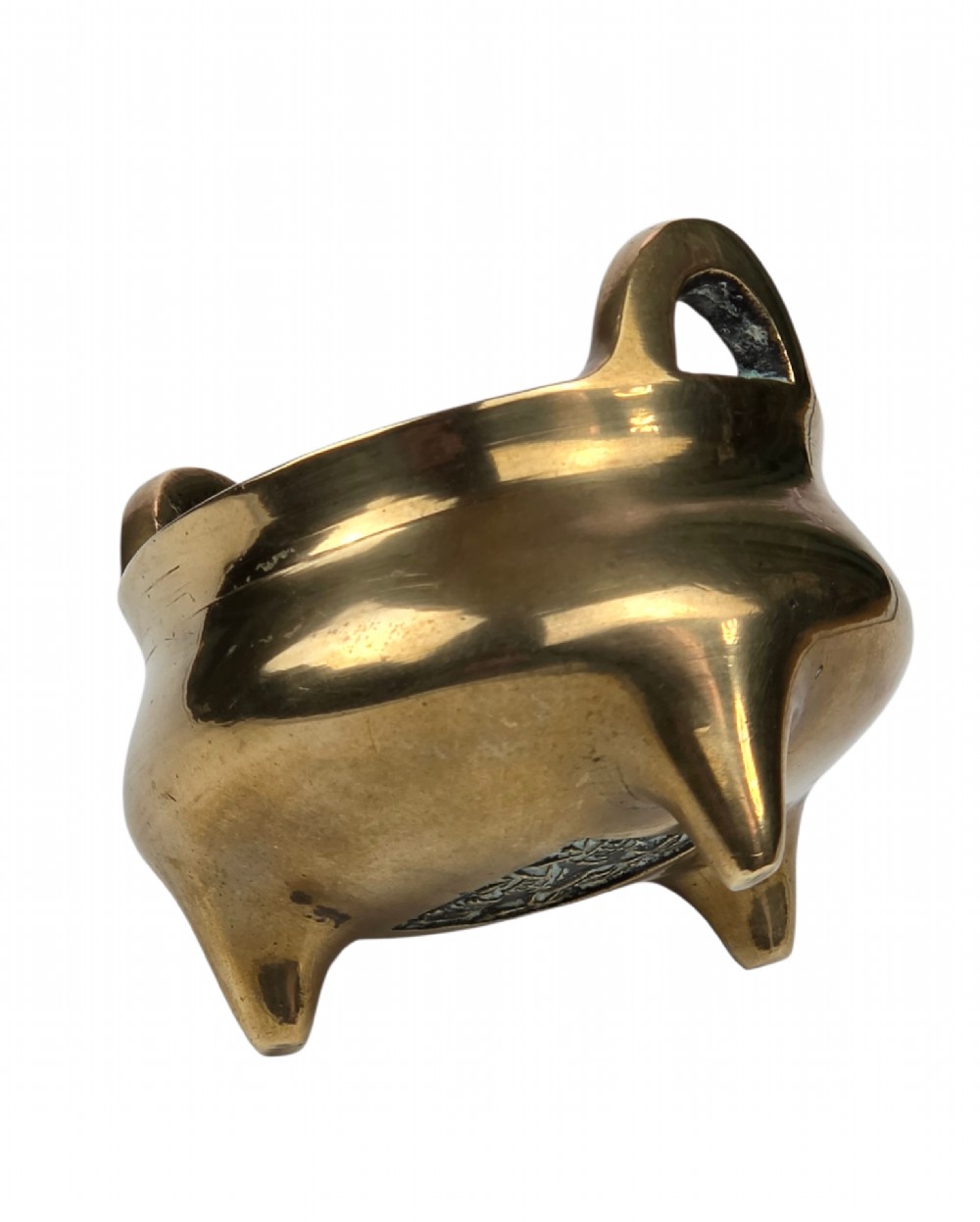A miniature cast bronze tripod censer featuring loop handles, conical legs, and natural surface patination. View X
