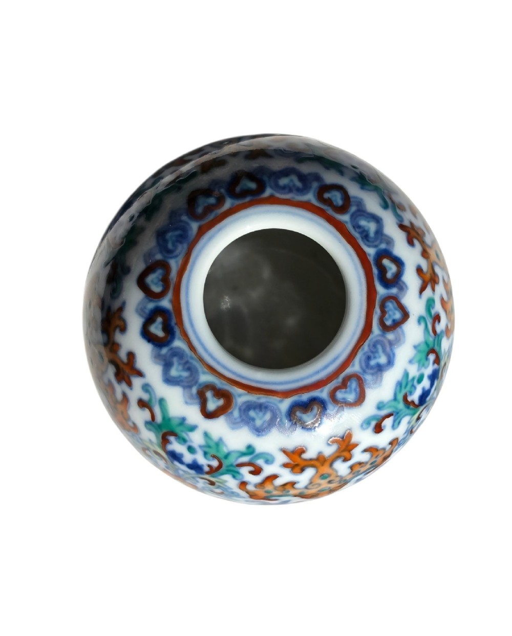 A rounded Chinese porcelain water pot decorated in doucai enamels with lotus flowers, bats, and scrolling foliage. View IV