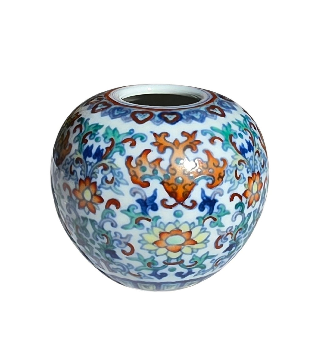A rounded Chinese porcelain water pot decorated in doucai enamels with lotus flowers, bats, and scrolling foliage. View VI