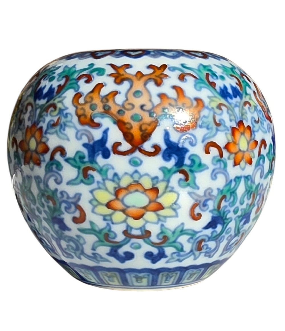 A rounded Chinese porcelain water pot decorated in doucai enamels with lotus flowers, bats, and scrolling foliage. View XI