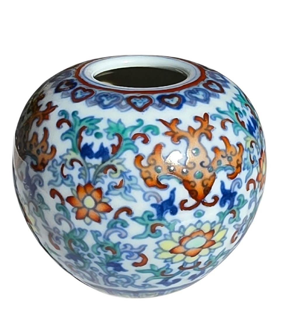 A rounded Chinese porcelain water pot decorated in doucai enamels with lotus flowers, bats, and scrolling foliage. View XII