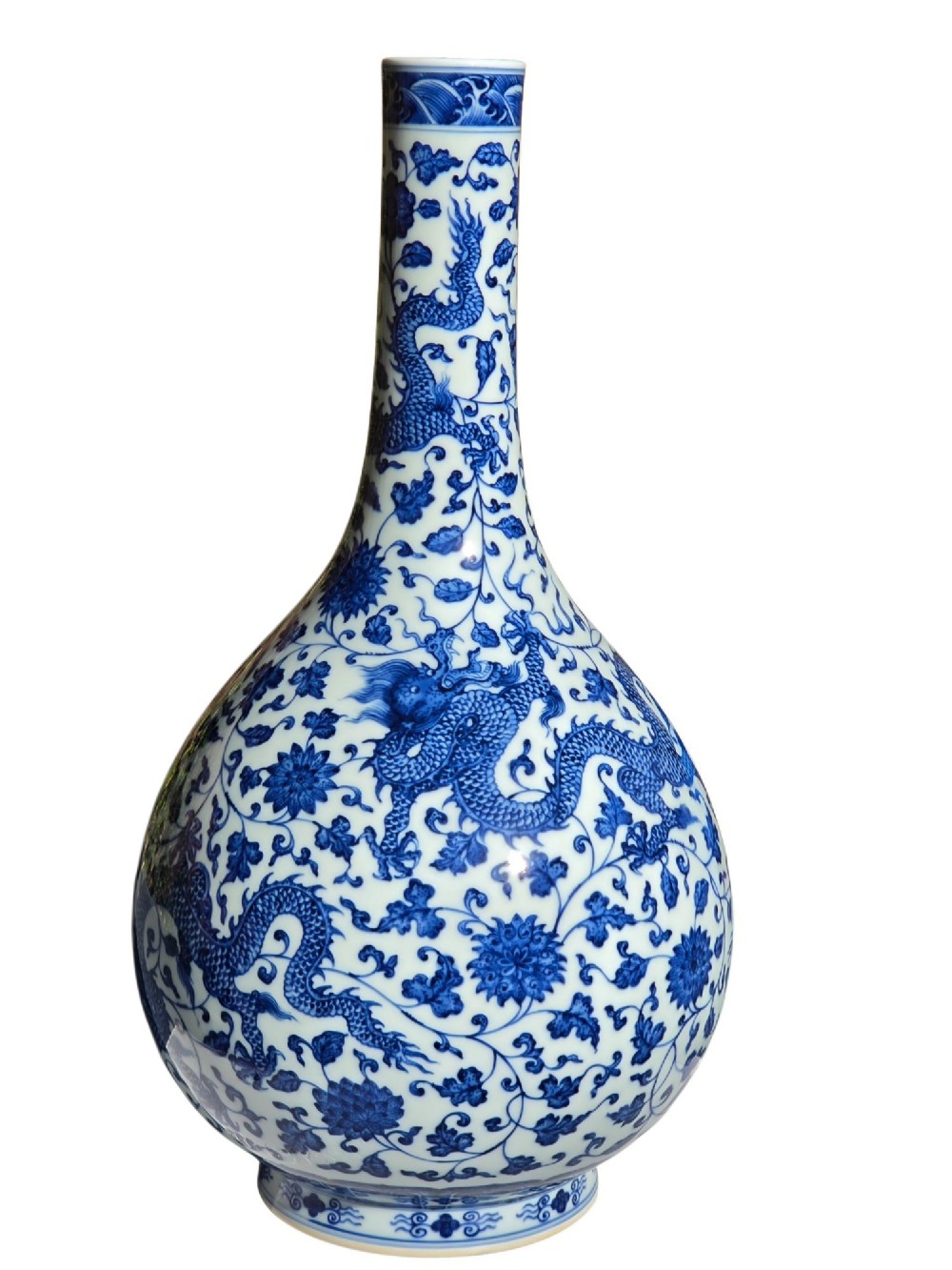 A pear-shaped Chinese porcelain bottle vase decorated with detailed underglaze cobalt blue five-clawed dragons amidst floral scrolls. View III